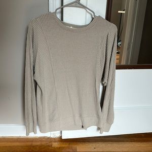 Tan ribbed sweater.